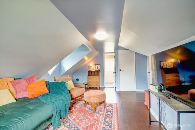 living room featuring lofted ceiling, wood finished floors, and baseboards