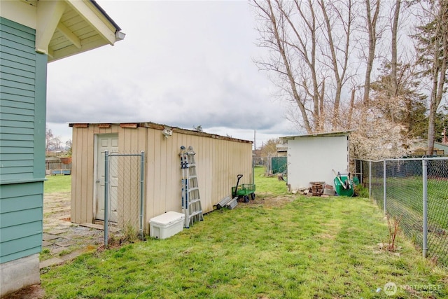 exterior space featuring a storage unit, an outdoor structure, and fence