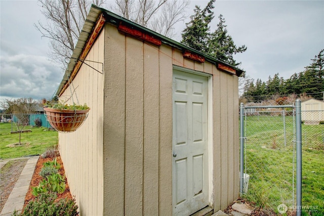 view of shed with fence