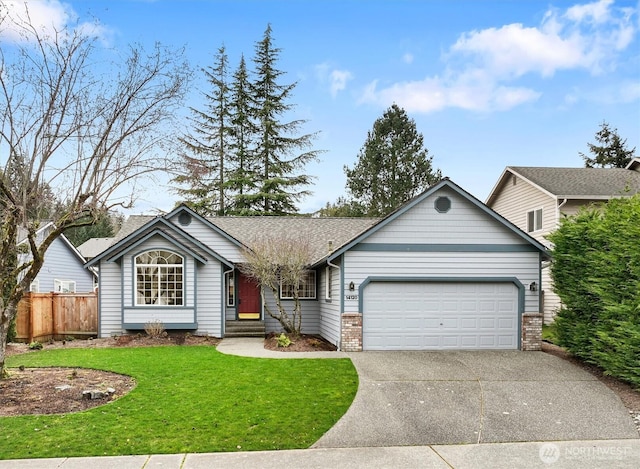 ranch-style house featuring a shingled roof, fence, a front yard, a garage, and driveway