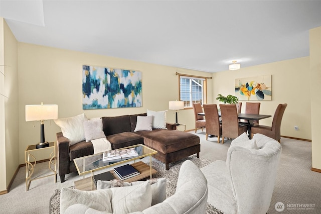 living room featuring baseboards and carpet flooring