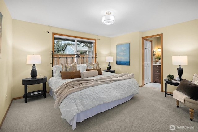 bedroom with baseboards and light carpet