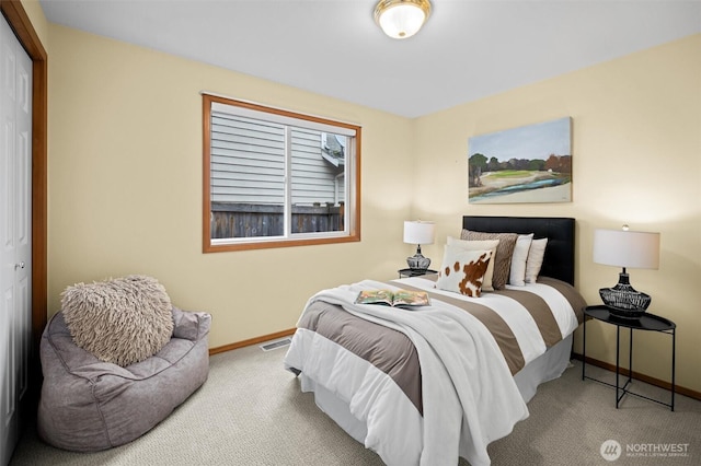 bedroom featuring baseboards and carpet floors