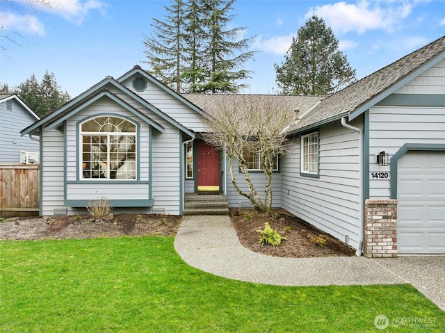 ranch-style home with fence, a front yard, an attached garage, and a shingled roof