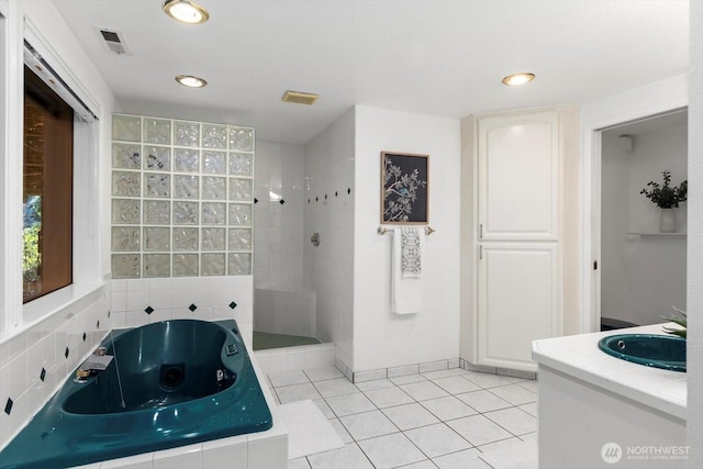 full bathroom featuring visible vents, a jetted tub, tile patterned flooring, a walk in shower, and recessed lighting