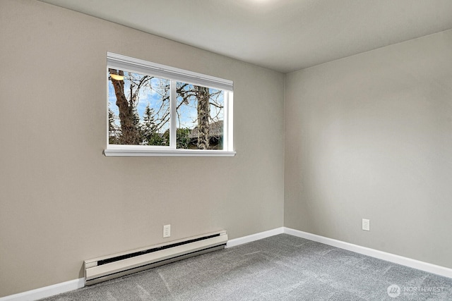 unfurnished room with a baseboard radiator, baseboards, and carpet flooring