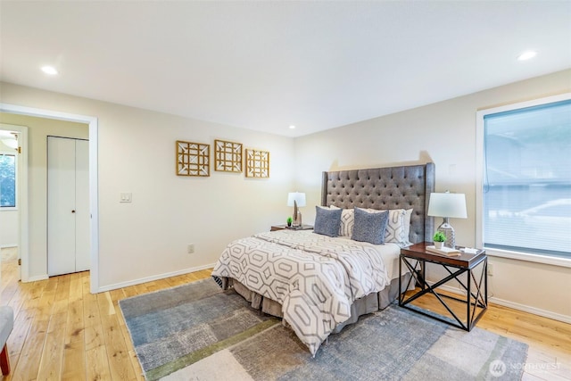 bedroom featuring recessed lighting, light wood-style flooring, and baseboards