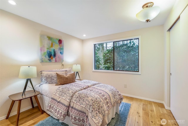 bedroom featuring recessed lighting, wood finished floors, and baseboards