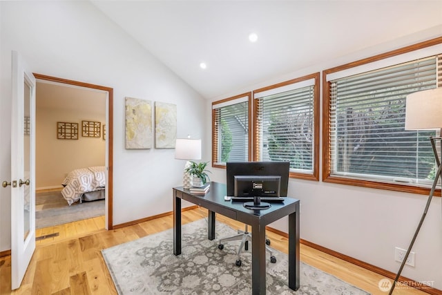 home office with baseboards, visible vents, recessed lighting, vaulted ceiling, and light wood-style floors