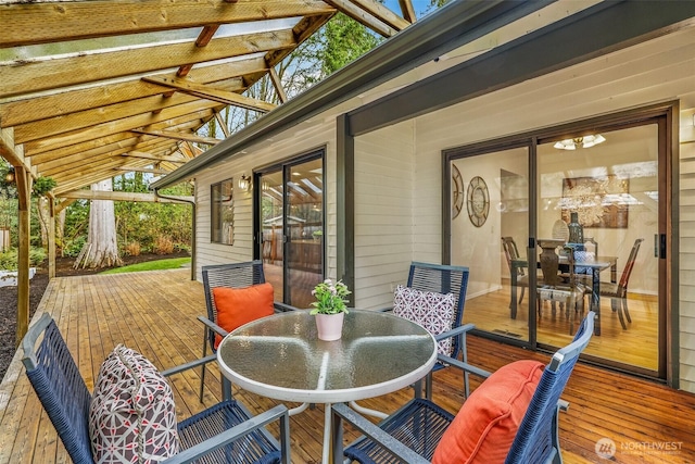 wooden deck featuring outdoor dining area