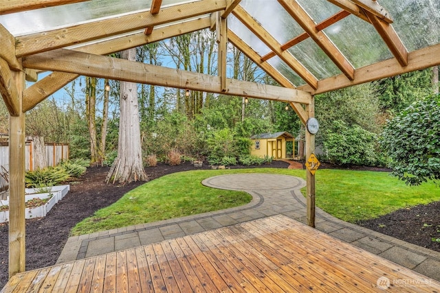 view of patio / terrace featuring a storage shed and an outdoor structure