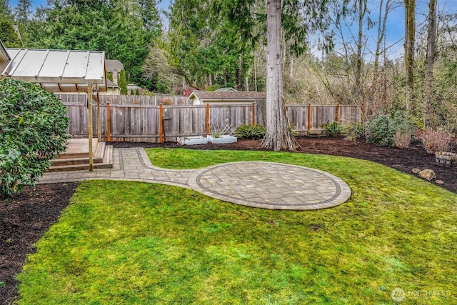 view of yard with a patio and fence