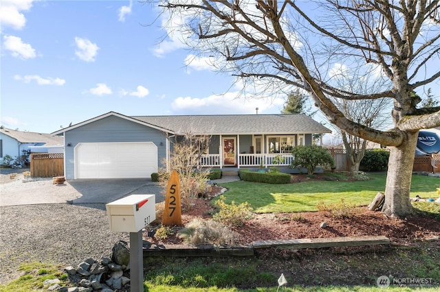 ranch-style house with fence, driveway, a porch, an attached garage, and a front lawn