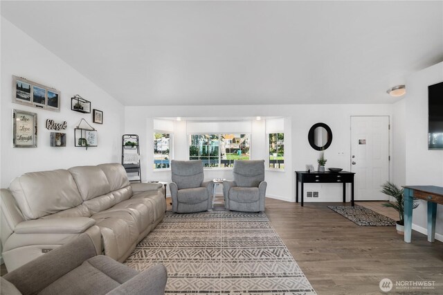 living room with baseboards and wood finished floors