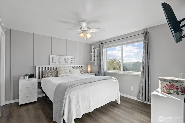 bedroom featuring ceiling fan, baseboards, and wood finished floors