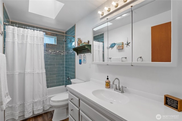 bathroom with toilet, vanity, and shower / bath combination with curtain