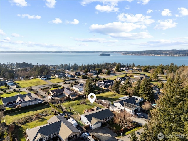 aerial view featuring a residential view and a water view