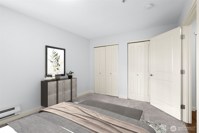 carpeted bedroom featuring baseboards, a baseboard heating unit, and multiple closets