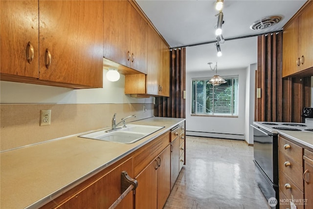 kitchen with light countertops, black electric range oven, visible vents, baseboard heating, and a sink