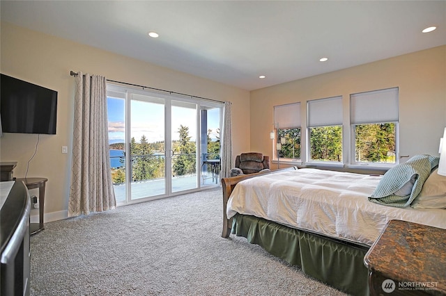 bedroom with access to outside, recessed lighting, and carpet