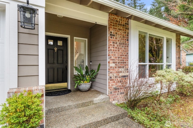 property entrance with brick siding