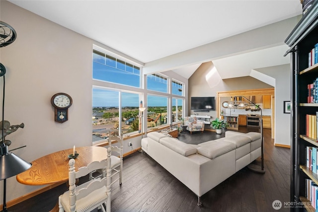 living room featuring high vaulted ceiling, dark wood-type flooring, and baseboards