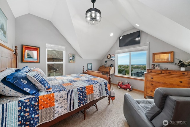 bedroom with carpet, baseboards, and vaulted ceiling