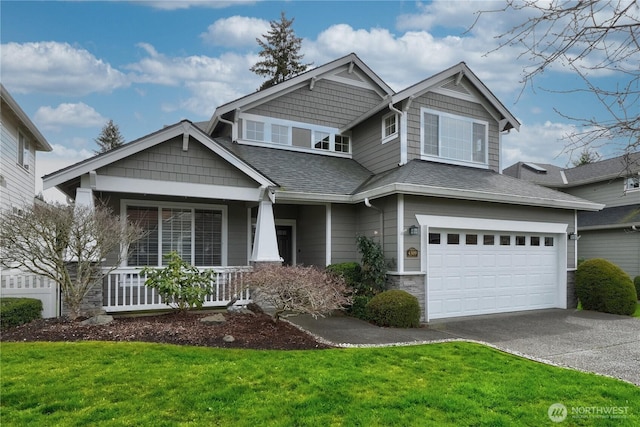 view of front facade featuring a shingled roof, a front lawn, covered porch, a garage, and driveway