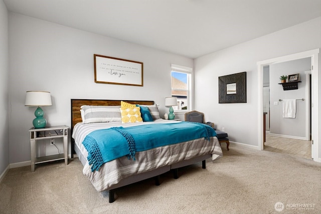 bedroom featuring baseboards and carpet