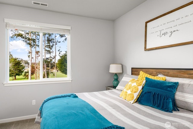 bedroom featuring carpet flooring, baseboards, and visible vents