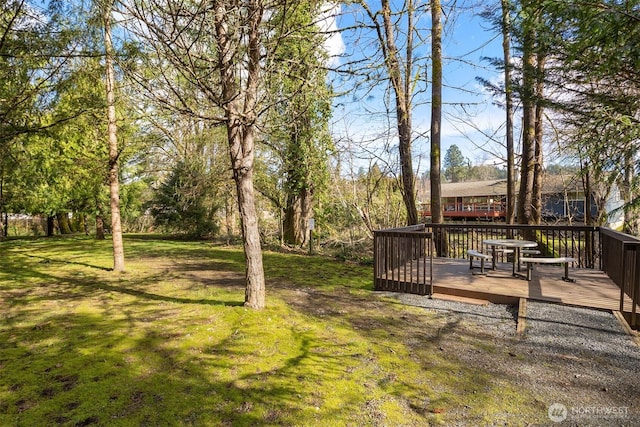 view of yard with a wooden deck