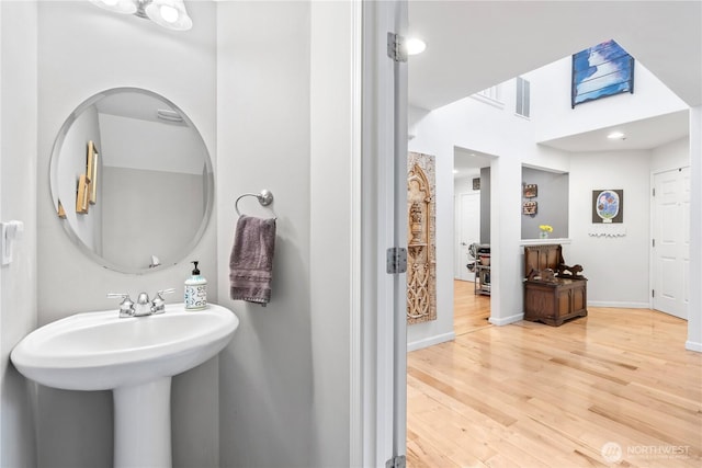 bathroom with visible vents, baseboards, and wood finished floors