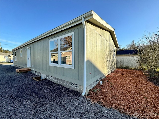 view of side of home with crawl space