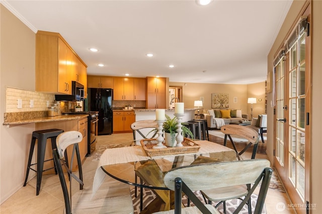 dining room with recessed lighting and french doors