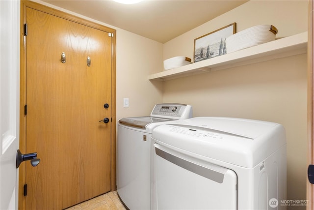 washroom featuring laundry area and washer and dryer