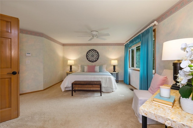 bedroom with baseboards, light carpet, ornamental molding, and a ceiling fan