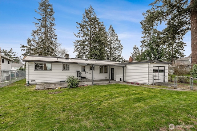 back of property with fence, an attached garage, a chimney, a patio area, and a lawn