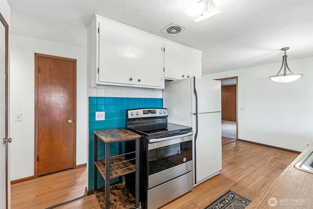 kitchen with white cabinetry, light wood-style flooring, stainless steel electric range, and freestanding refrigerator