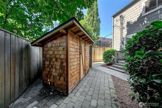 view of shed featuring a fenced backyard