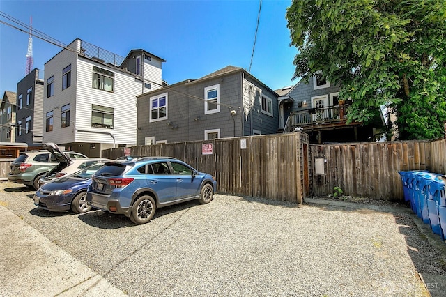 exterior space with fence and a residential view