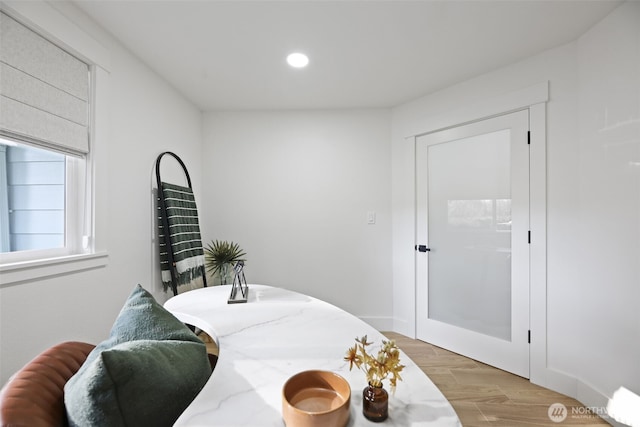 dining area with light wood-style flooring and recessed lighting