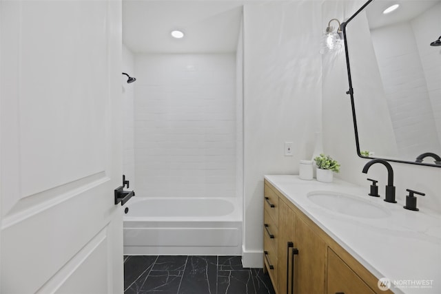 full bathroom with marble finish floor, vanity, washtub / shower combination, and recessed lighting