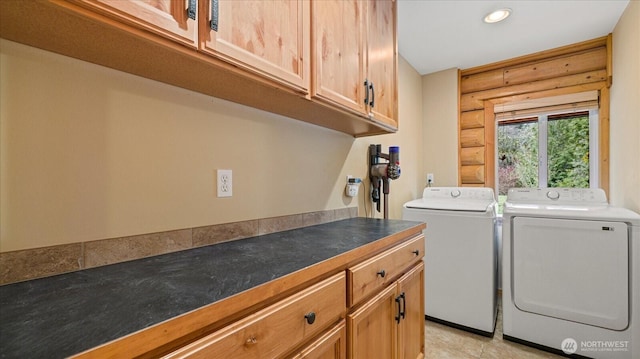 clothes washing area featuring cabinet space, recessed lighting, washer and dryer, and log walls