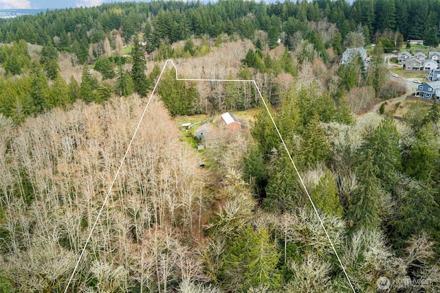 drone / aerial view with a view of trees