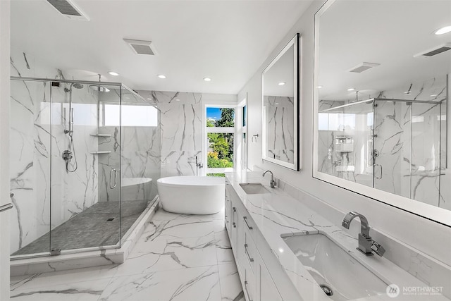 full bath with stone wall, visible vents, marble finish floor, and a sink