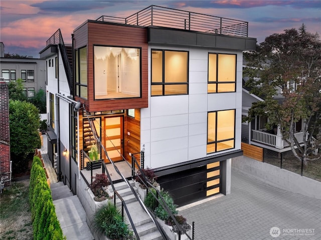 view of front of home with stairs