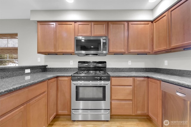 kitchen featuring appliances with stainless steel finishes and light wood-type flooring