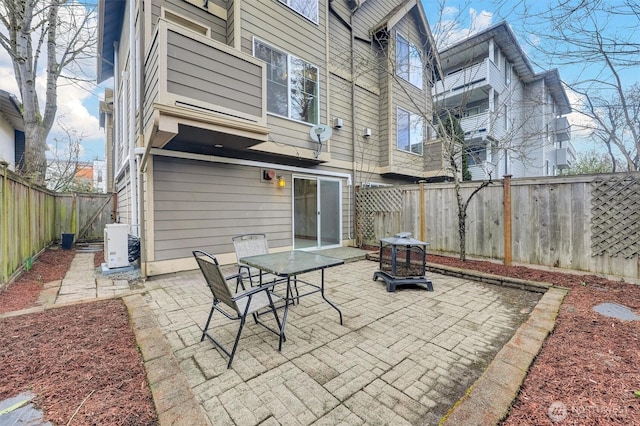 view of patio / terrace featuring ac unit and a fenced backyard