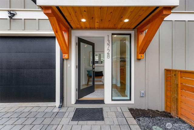 doorway to property featuring board and batten siding