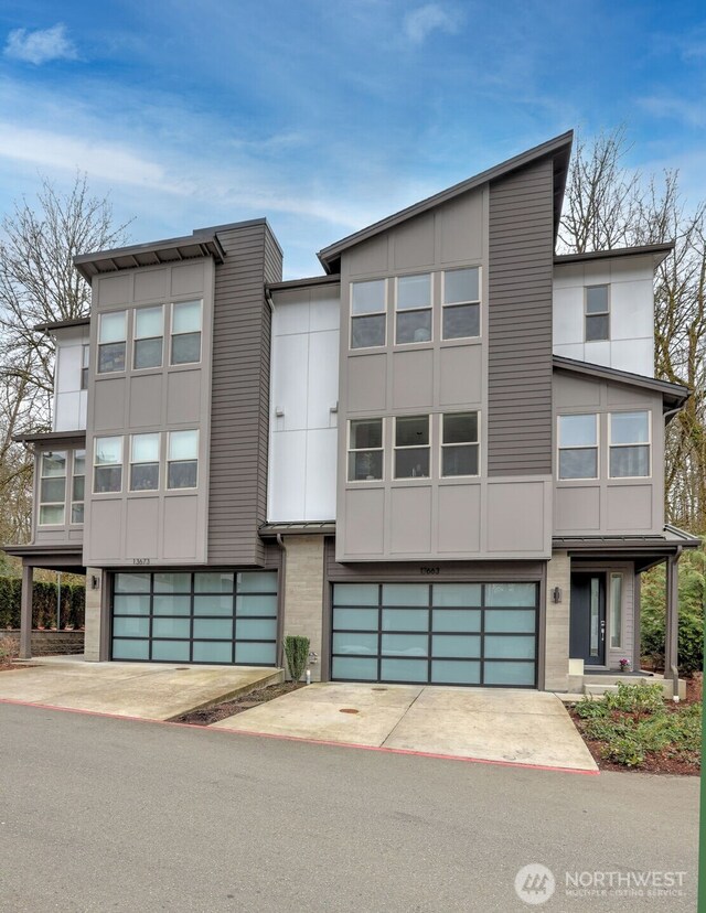 modern home featuring a garage and driveway